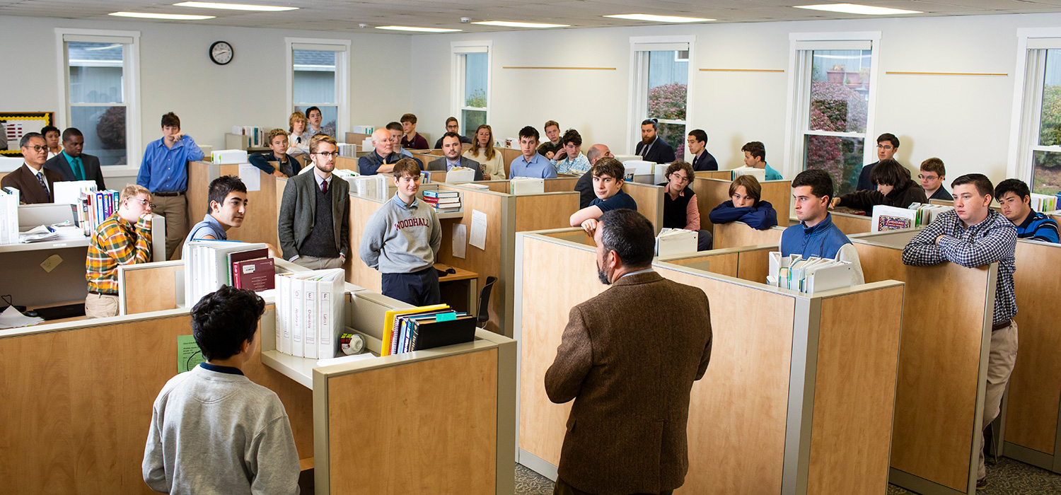 students and teachers in a morning meeting