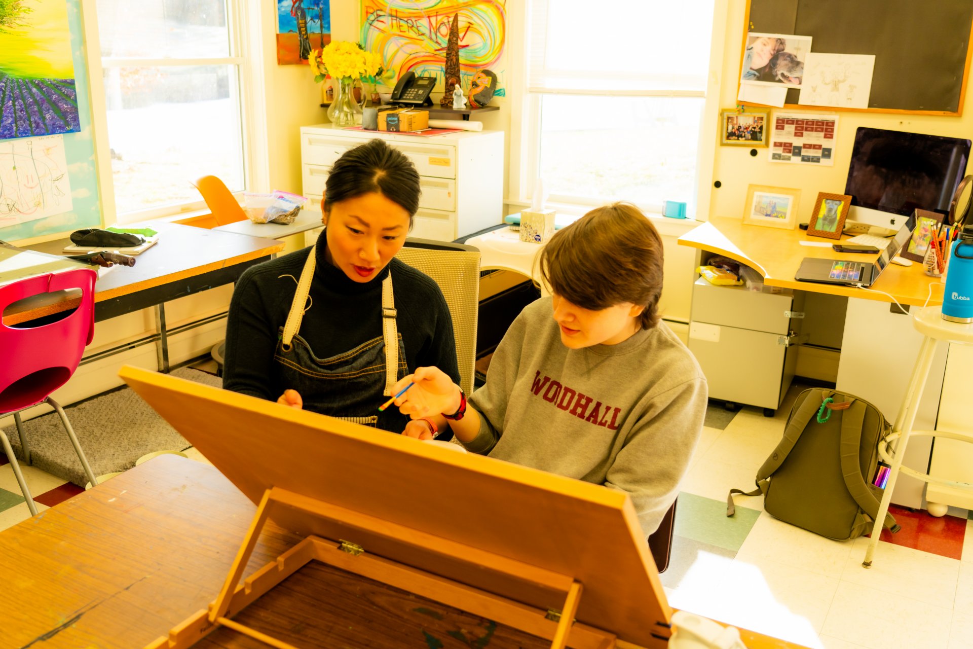 teachers playing board game with students